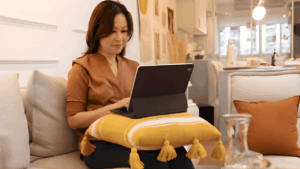 Online furniture and décor shopping concept showing a modern living space with stylish home furniture and interior décor items available for purchase.
