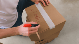 A moving and organizing process showing packed boxes and decluttered home items during a big move