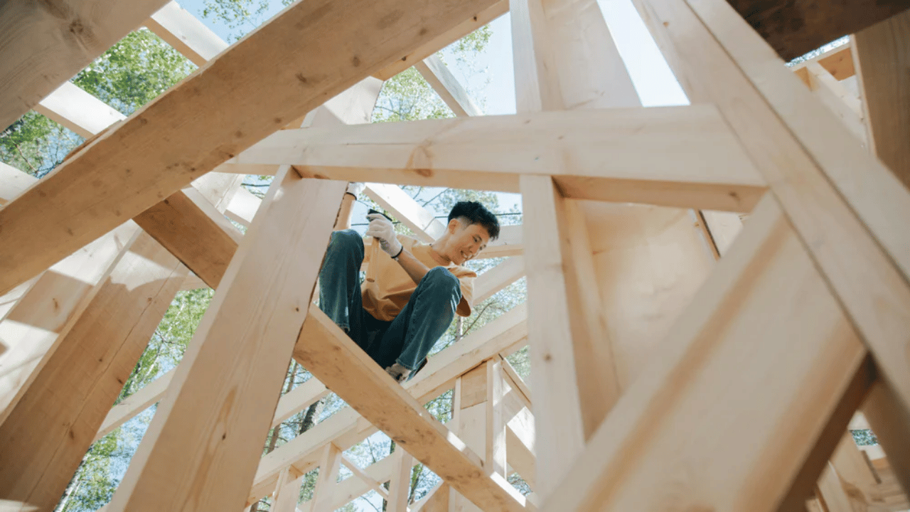 Modern residential construction scene showing builders working on strong structural frameworks and materials designed to ensure long-lasting, durable homes.