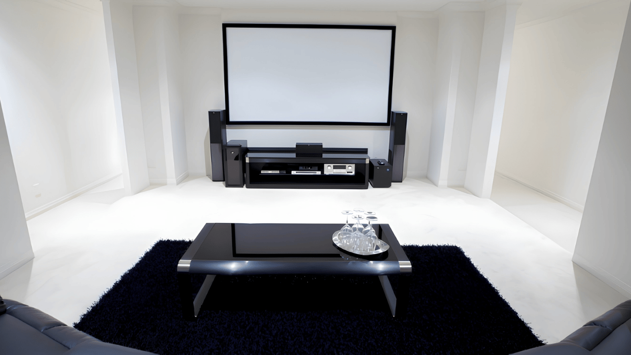 Modern home theater system setup in a living room with large screen, surround sound speakers, and comfortable seating for immersive entertainment.