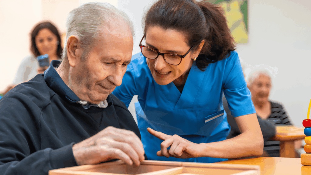 Elderly seniors receiving compassionate support in a memory care setting, highlighting the importance of specialized care for individuals with memory-related conditions.