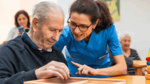 Elderly seniors receiving compassionate support in a memory care setting, highlighting the importance of specialized care for individuals with memory-related conditions.