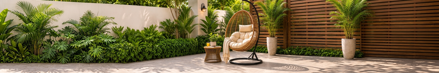 Rattan egg swing chair with cushion on a luxury garden patio